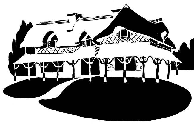 Black and white image of ornate thatched cottage